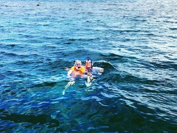 Two men in the water snorkeling.
