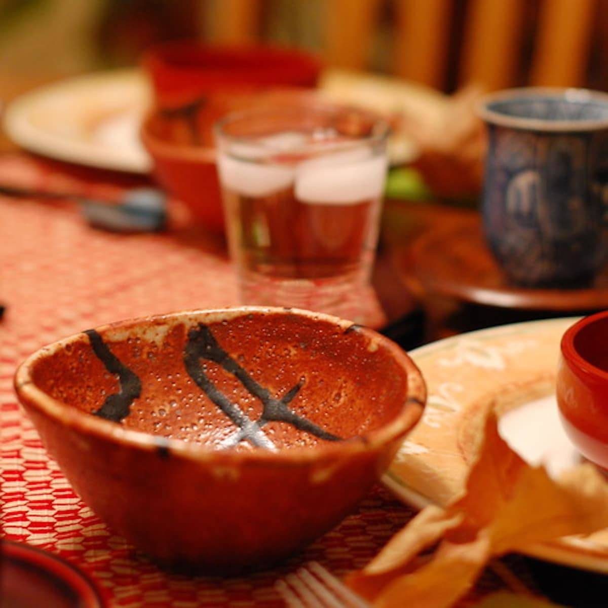 Bowl and glasses on a table.