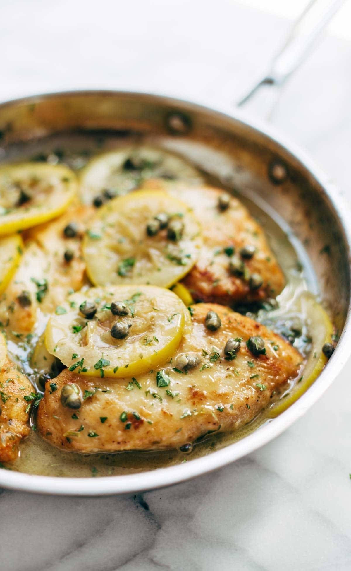 Chicken Piccata - you won't believe how easy this recipe is! Perfect with a green salad and grilled bread for soaking up all the extra sauce. | pinchofyum.com