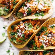 Tacos with chicken tinga and onion.