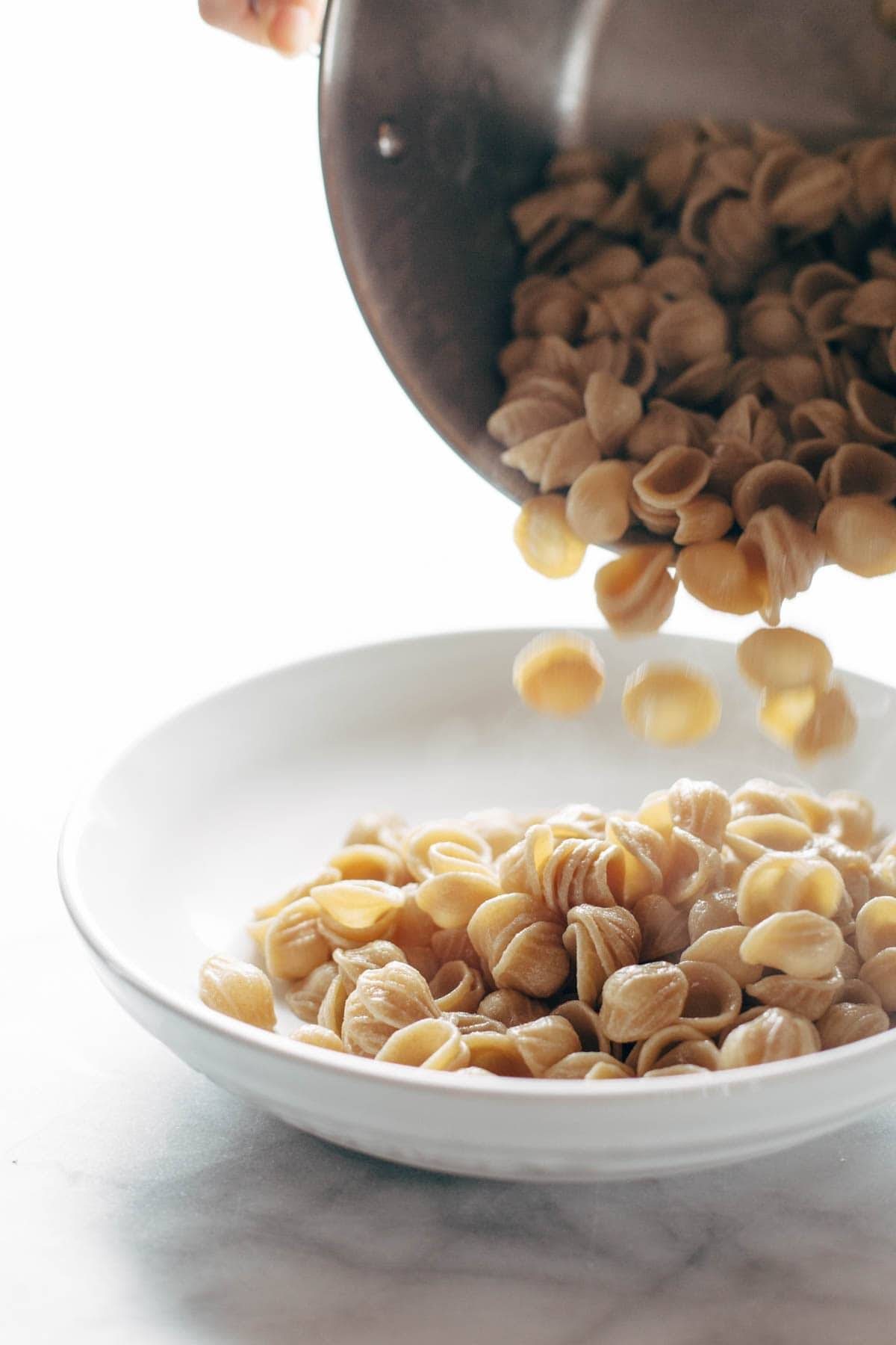 pasta falling into a bowl
