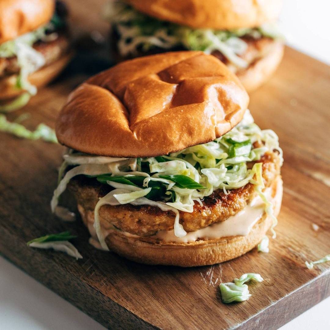 Chicken teriyaki burgers topped with slaw.