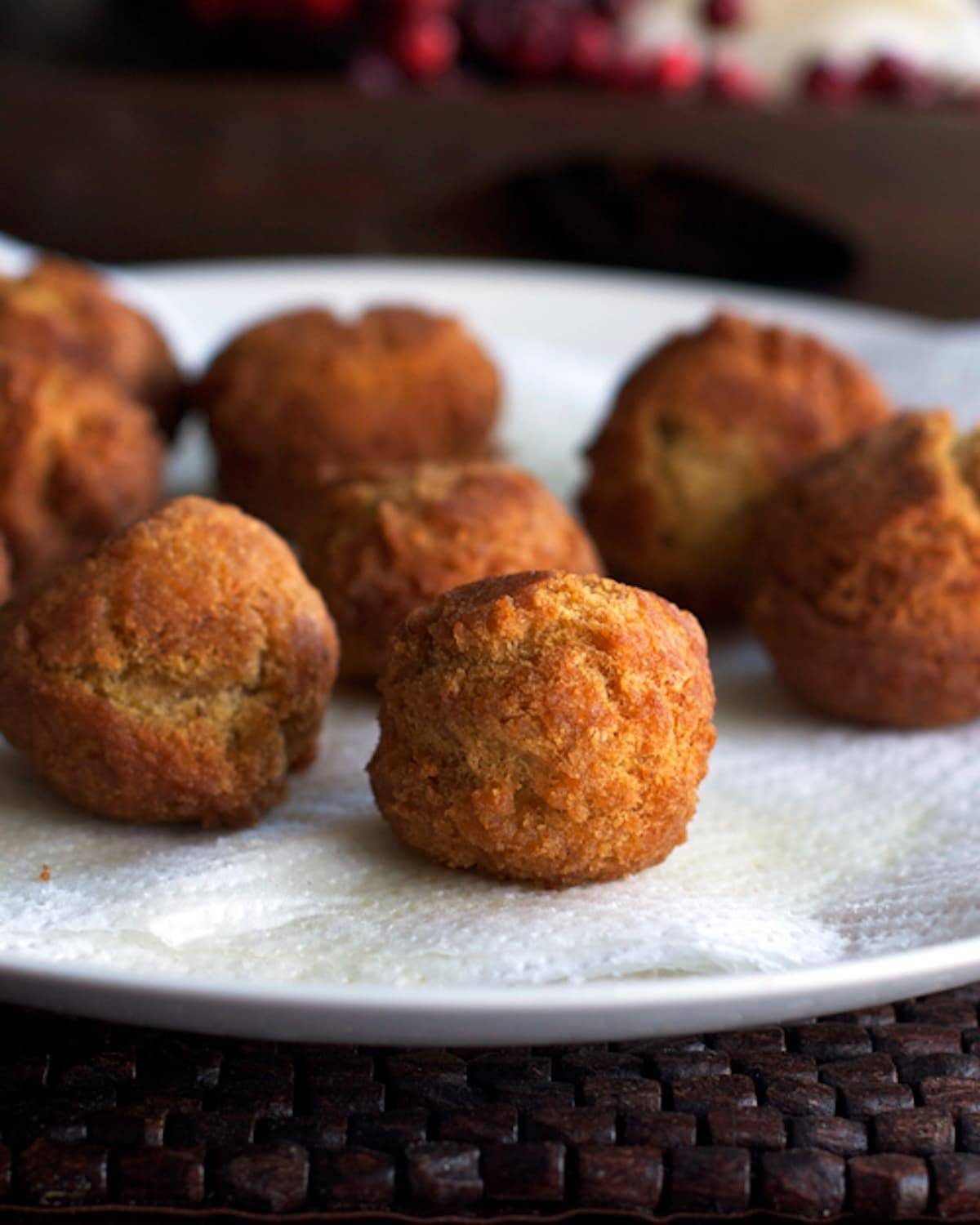 Cinnamon sugar donut balls on a plate.
